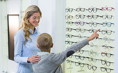 Child picking out glasses