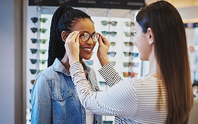 Woman trying on glasses