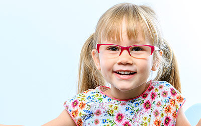 Girl child smiling with glasses on